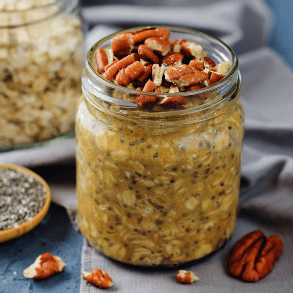 Pumpkin Chia seeds overnight oats with pecans. toning. selective focus.