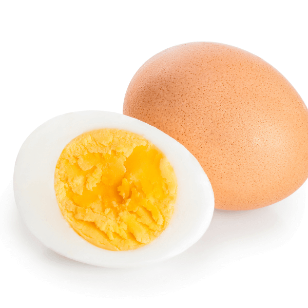 Half hard boiled egg and brown egg in shell on white background.