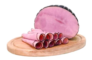 Slices of Black Forest Ham on a serving board.