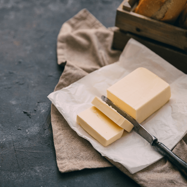 sliced fresh butter with butter knife