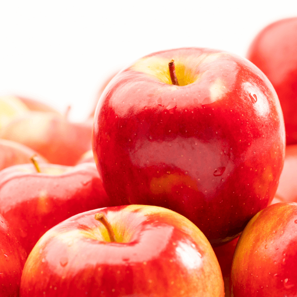 Close up of pile of fresh Ambrosia apples.