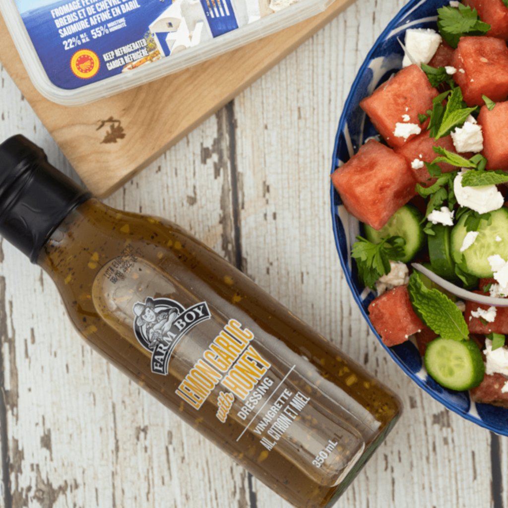 Bottle of Farm Boy Lemon Garlic with Honey Dressing on wooden table