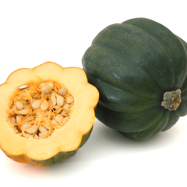 Whole and half of acorn squash on white background.