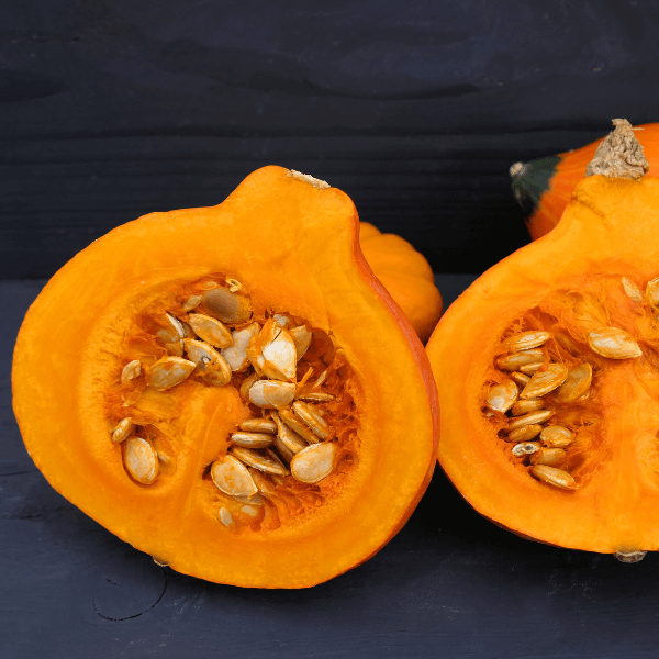 Halved golden nugget squash with seeds.