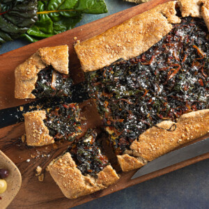 Rustic Swiss Chard and Ricotta Galette on a serving board.