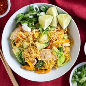 Chicken Lo Mein made with Farm Boy products served in a bowl with sides.